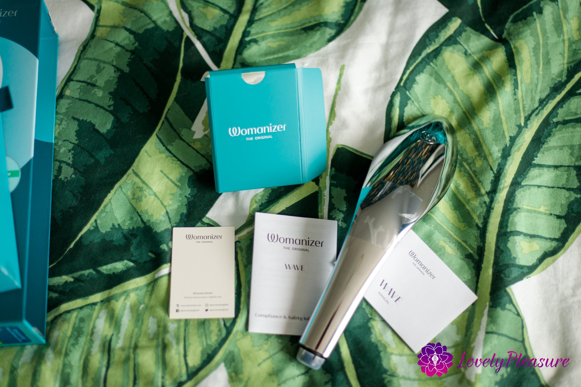 Douchette Womanizer Wave - Le pommeau de douche combiné avec un stimulateur clitoridien